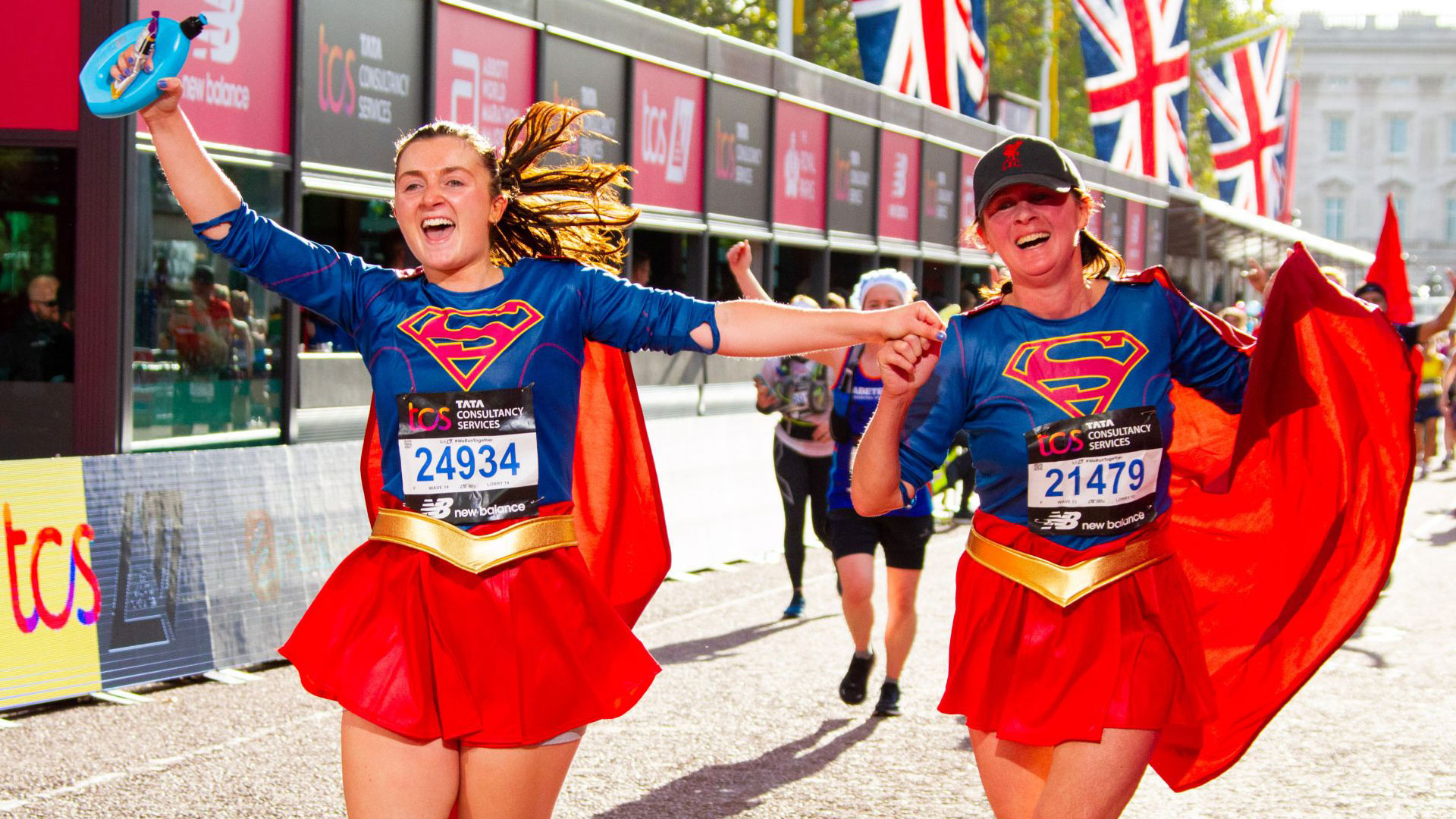 Marathon participants in supergirl cosplay