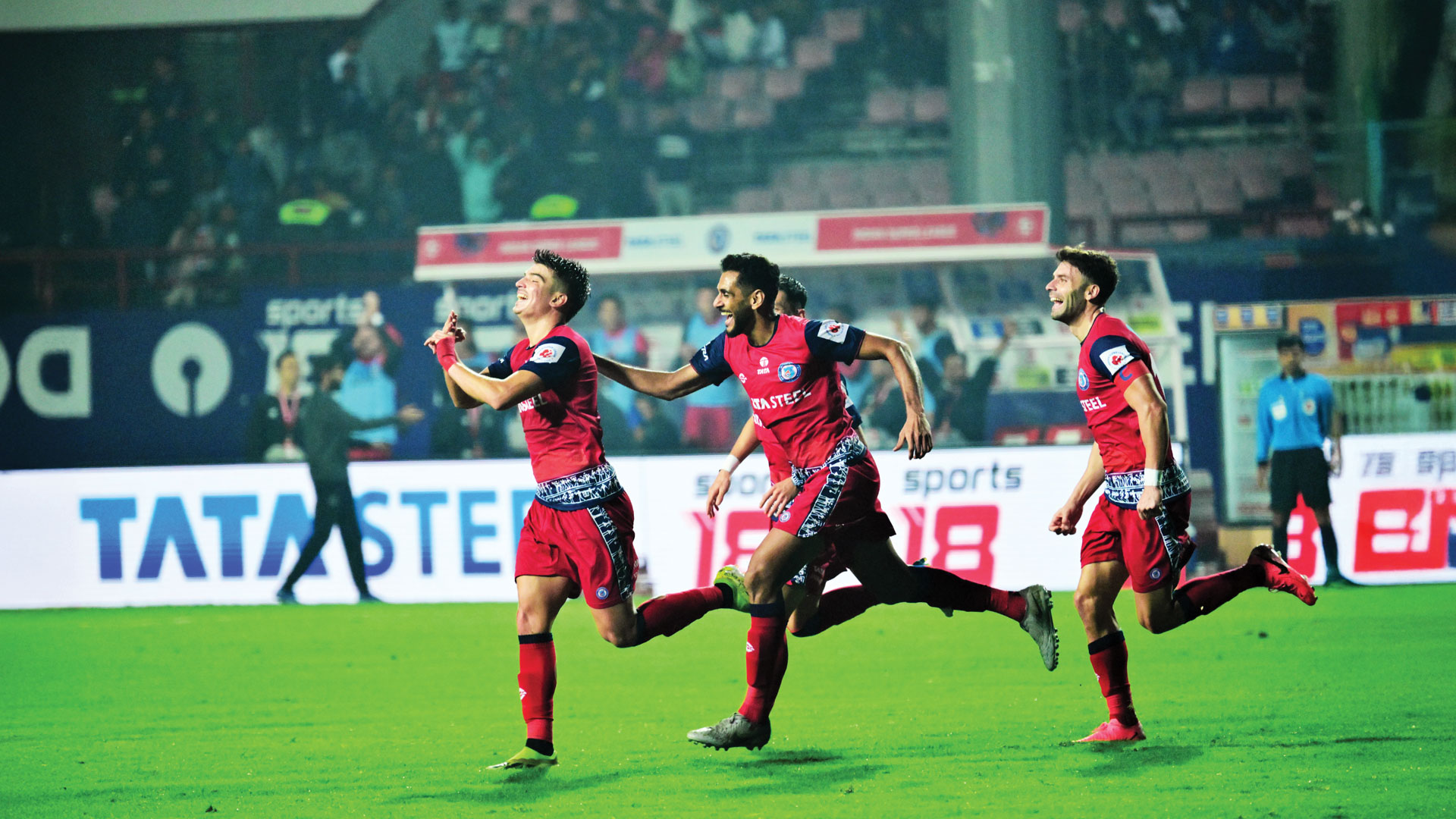 Jamshedpur FC players celebrate after a goal