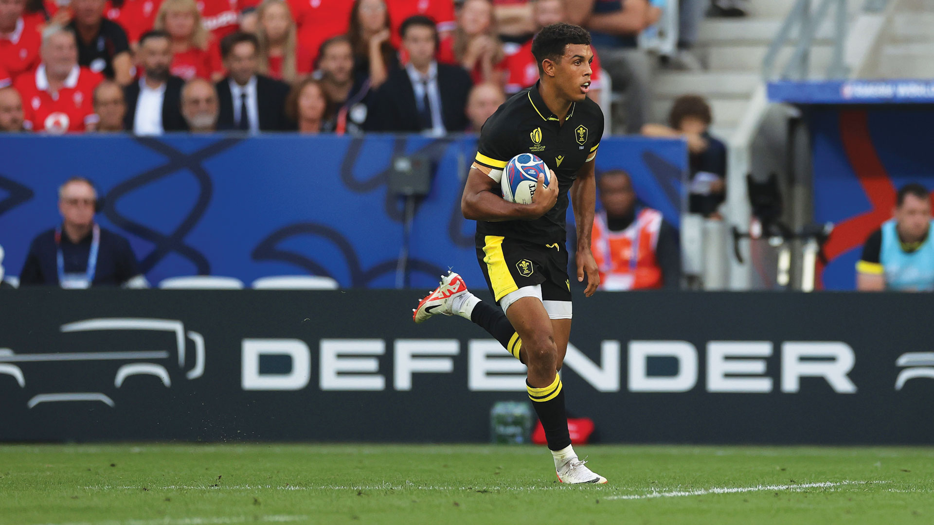 A rugby player running for a touchdown