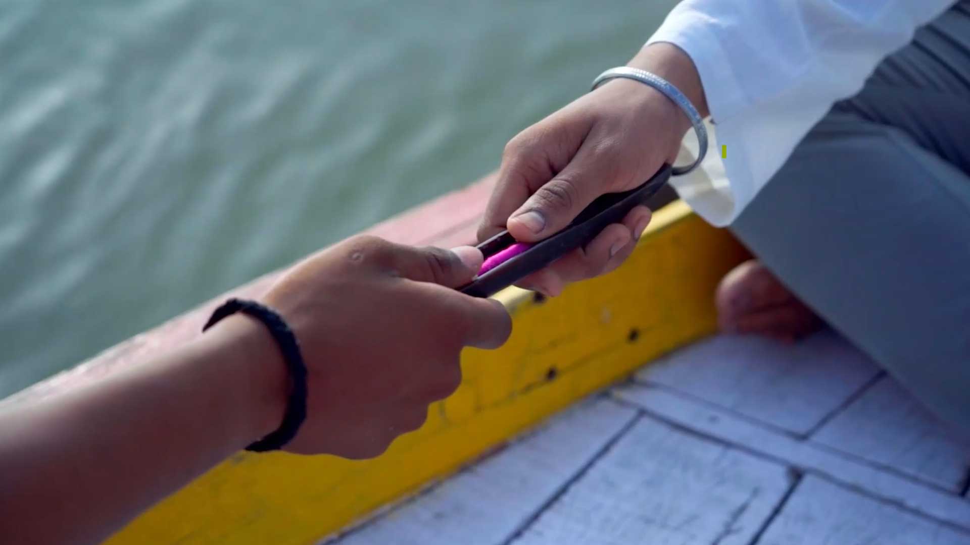 An image and video depicting weavershala artisans