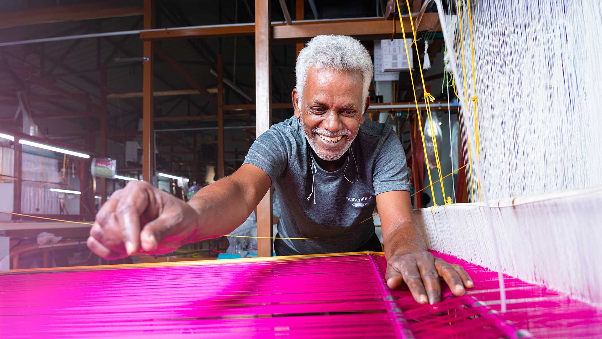 A weaver on handloom practicing his craft